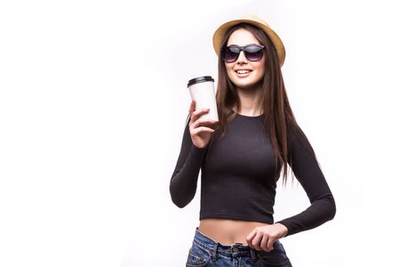 Portrait of happy beauty girl in sunglasses drink tea or coffee from paper cup on white background.の写真素材