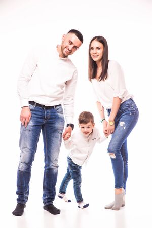 Happy family. Father, mother and boy over white backgroundの写真素材