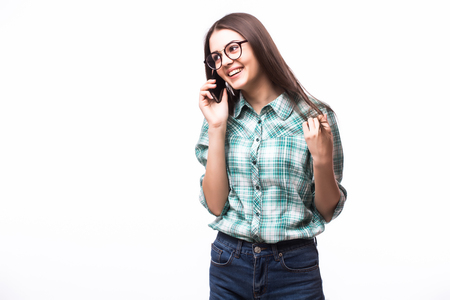 Young Woman Using a Cell Phone Isolated on Whiteの写真素材