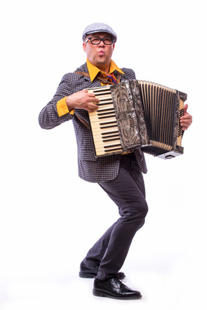Male singer artist play on accordion on white backgroundの写真素材