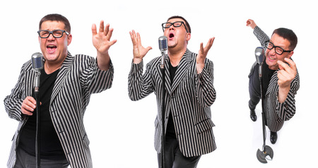 Showman concept. Singer with microphone on white backgroundの写真素材