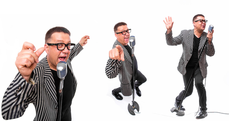 Showman concept. Singer with microphone on white backgroundの写真素材