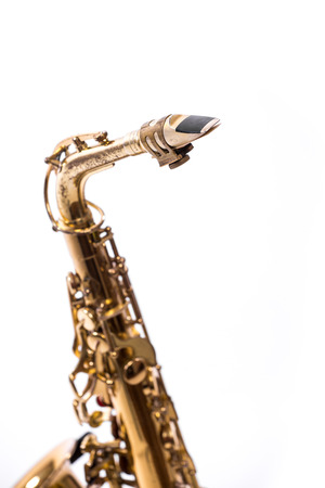 Saxophone - Golden alto saxophone classical instrument isolated on whiteの写真素材