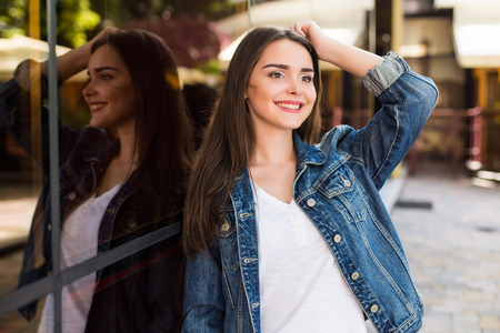 Smile girl in sunglasses  in summer city from above. Urban lifestyle concept.の写真素材