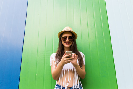 Hipster cool girl taking picture on smartphone self-portrait, screen viewの写真素材