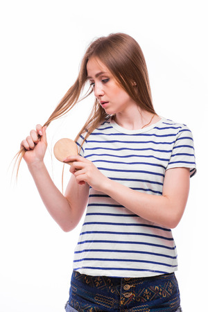Beautiful girl  Brushing Her Hair. Hair Careの写真素材