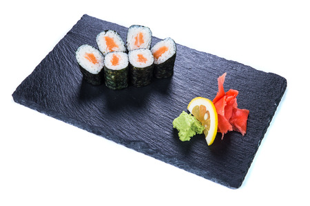 Sushi Set nigiri and sushi rolls on black stone slate. Restaurant food concept.の写真素材
