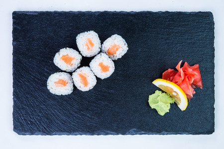 Sushi Set nigiri and sushi rolls on black stone slate. Restaurant food concept.の写真素材
