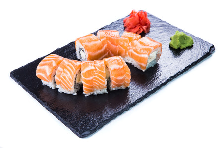 Sushi Set and sushi rolls on black stone slate. Restaurant food concept.の写真素材