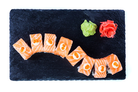 Sushi Set and sushi rolls on black stone slate. Restaurant food concept.の写真素材