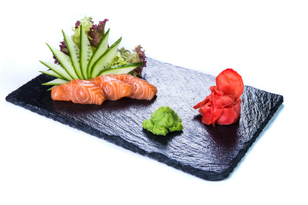 Sushi Set and sushi rolls on black stone slate. Restaurant food concept.の写真素材