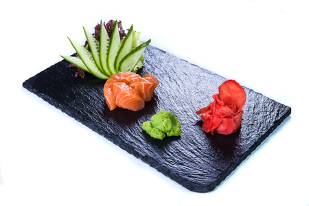 Sushi Set and sushi rolls on black stone slate. Restaurant food concept.の写真素材