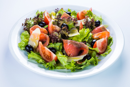 Fish salad - grilled salmon and vegetables. Restaurant food conceptの写真素材