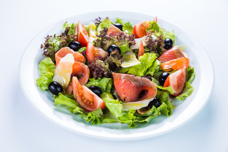Fish salad - grilled salmon and vegetables. Restaurant food conceptの写真素材