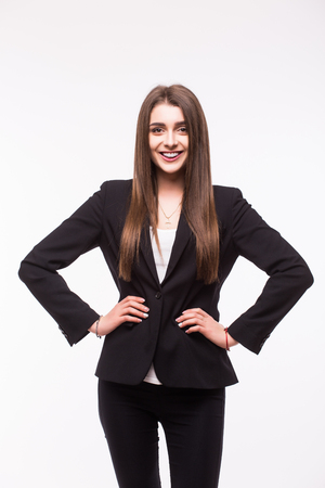 Portrait of young woman with hands on shoulders over a white backgroundの写真素材