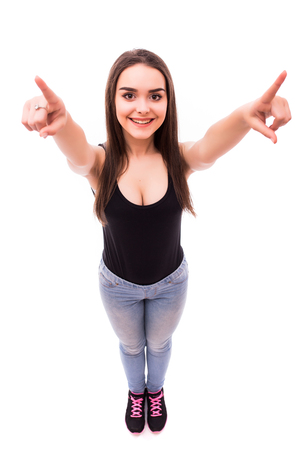 Beauty girl pointing with finger up on white background from aboveの写真素材