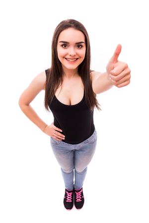 Teen girl with okey gesture from above on whiteの写真素材