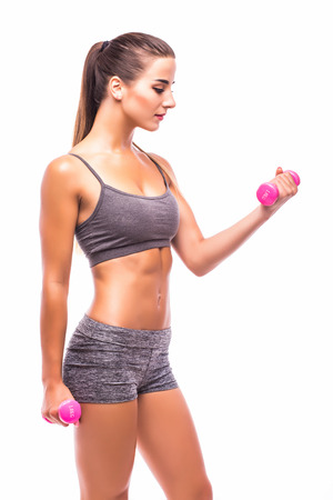 Woman exercising with dumbbellsの写真素材