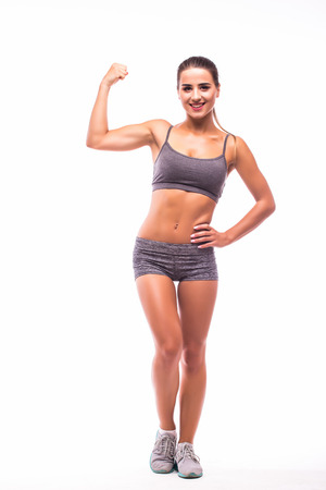 Muscular young woman athlete demonstrate power of bodyの写真素材