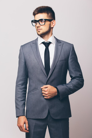 Portrait of young man in suitの写真素材
