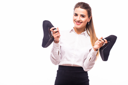 successful business woman with shoes in hand on white backgroundの写真素材