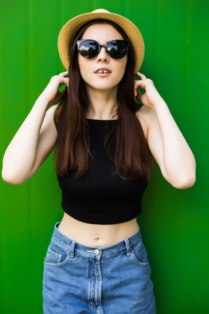 Beautiful girl on green backgroundの写真素材