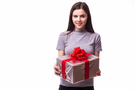 young girl giving a present. isolated over white backgroundの写真素材