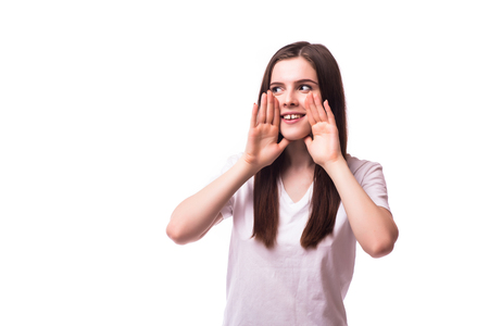 Screaming girl on white background. People emotions conceptの写真素材