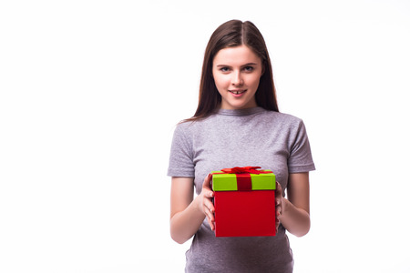 portrait of young beautiful woman with gift box isolated on white backgroundの写真素材