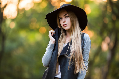 beautiful girl in black hat, outdoorsの写真素材