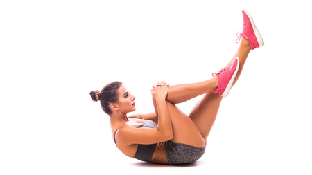 young woman doing exercise The Single-Leg Stretch