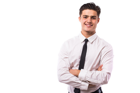Young handsome business man with crossed handsの写真素材