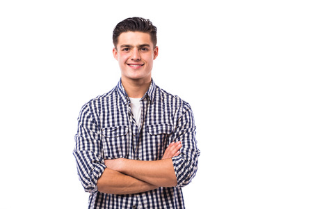 Elegant young handsome man with crossed hands in shirt.の写真素材
