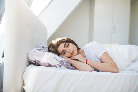 Young beautiful woman sleepingの写真素材