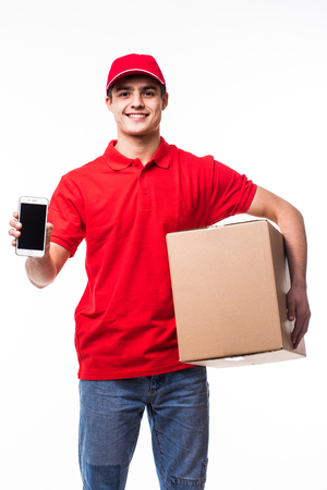 Delivery man or courier with box pointed phone on youの写真素材