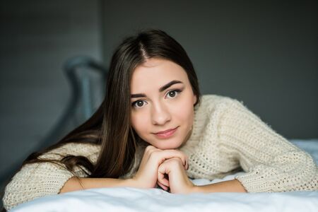 woman have fine on her bedroom. Young lady enjoying her morning and wake up.の写真素材