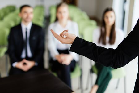 Hands of speker at meeting of team in office.の写真素材