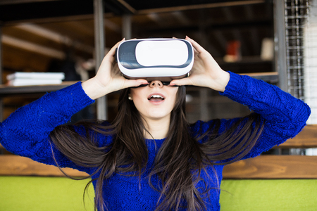 woman using modern virtual reality glasses