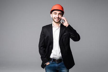 Architect using mobile phone on white backgroundの写真素材