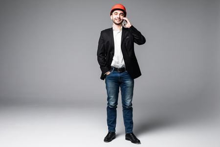 Architect using mobile phone on white backgroundの写真素材