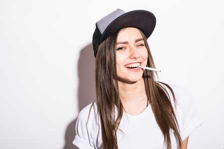 sexy smoking beautiful woman cigar closeup studio shotの写真素材