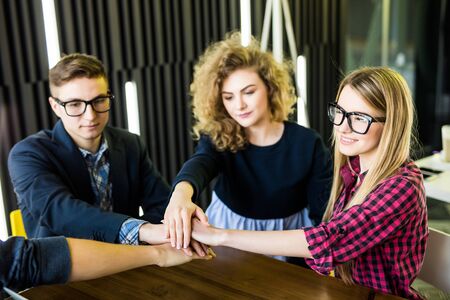 Teamwork concept. United hands of business teamの写真素材