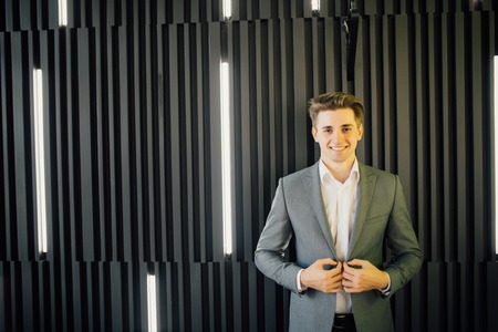 Portrait of a handsome young man in a business suitの写真素材