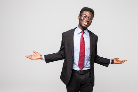business black man doing a balance on greyの写真素材