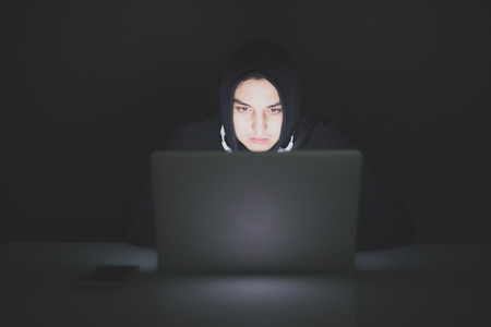 Portrait of hacker and laptop meaning safety dataの写真素材