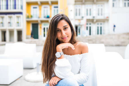 Street portrait of young beautiful woman summer