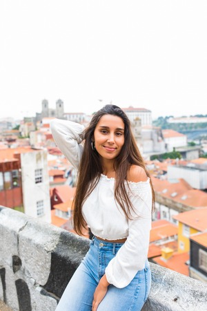 Young tourist admiring the view of Porto from topの写真素材