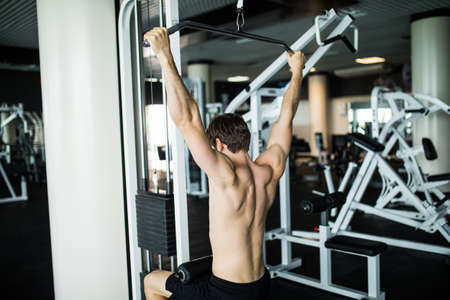 Brutal caucasian handsome fitness men on diet training chest pumping up body