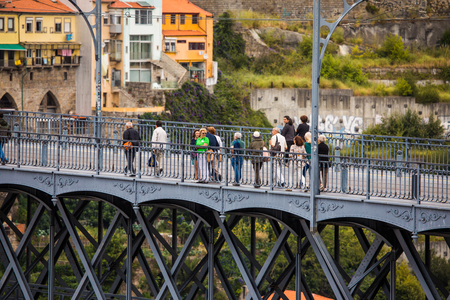 View of the iconic Dom Luis I bridge crossing the Douro River, and the historical Ribeira and Se District in the city of Porto, Portugal.のeditorial素材