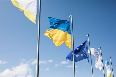 Ukraine and european union flags on flagpoles